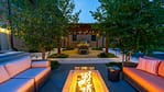 Twilight view of pool, spa, and pergola in Milwaukee landscape design-build outdoor space