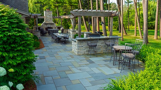 finished winter landscaping project with patio and fire-feature by David J. Frank