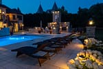 Luxury backyard with pool, fireplace, and lighting in Elm Grove WI